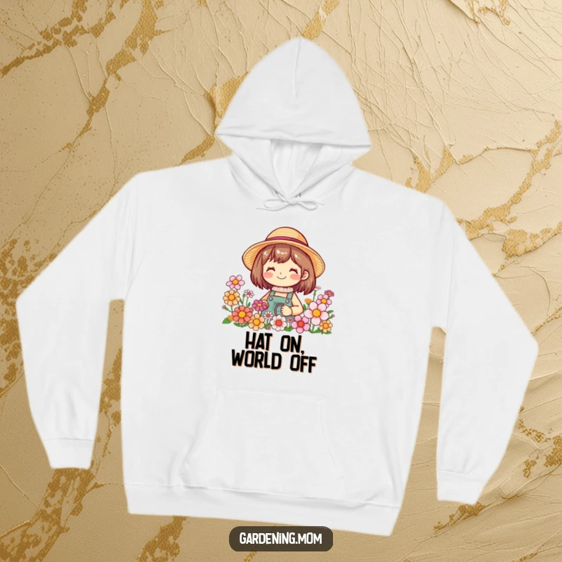 Funny hoodie featuring a smiling gardening character wearing a straw hat, enveloped by a profusion of colorful, blooming flowers.