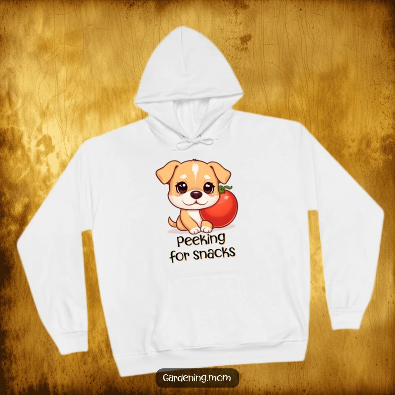 Funny mama dog hoodie with curious eyes peeking out from behind a juicy tomato, evoking a sense of playful discovery.