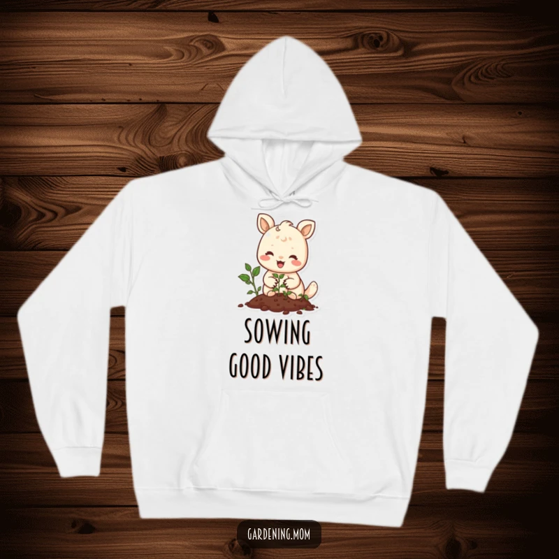 Funny hoodie depicting a joyful animal gently planting seeds with a smile, offering warmth and peaceful garden vibes.